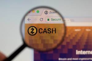 Zcash logo on a computer screen with a magnifying glass